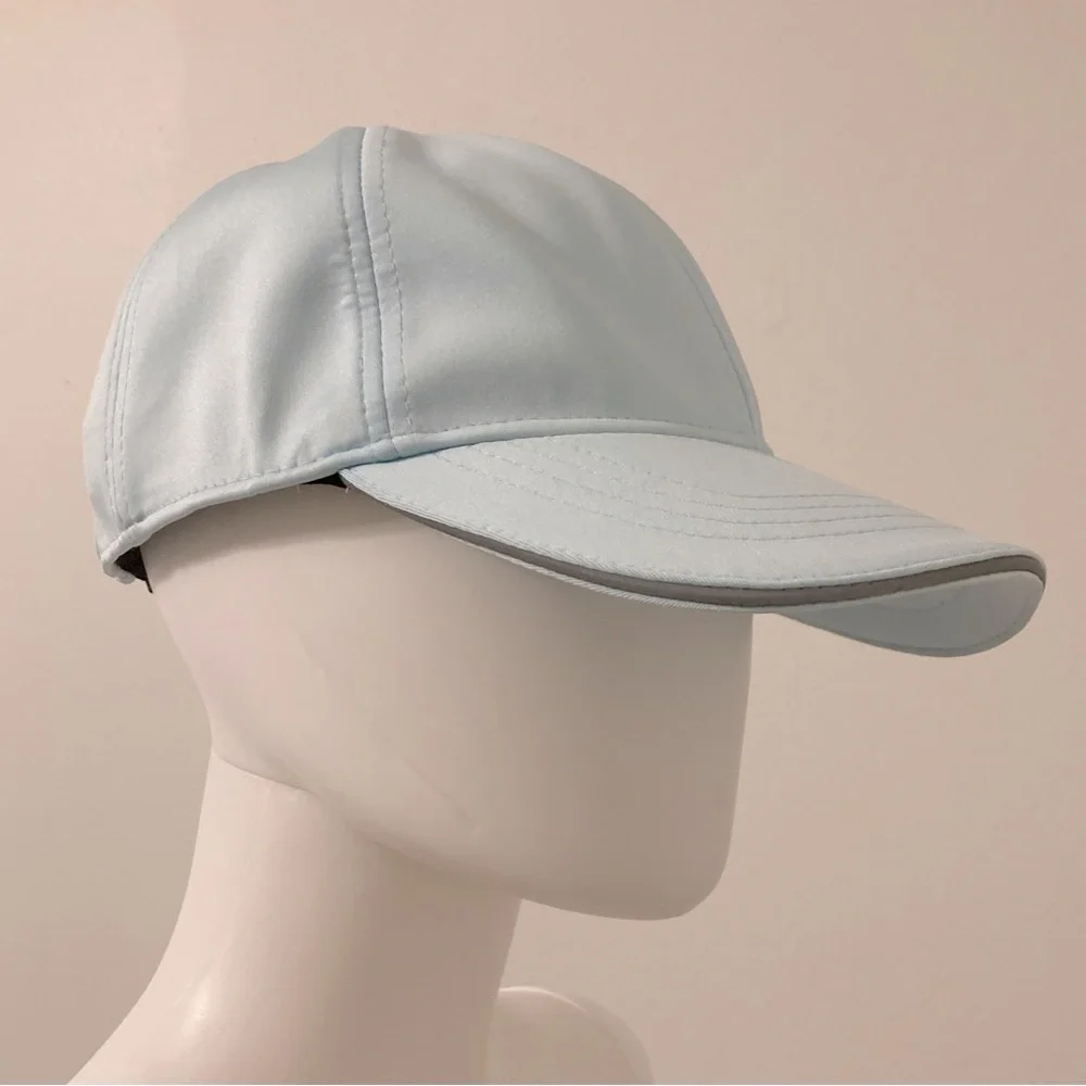 light blue baseball cap with reflective stripe on the peak self-adjusting .